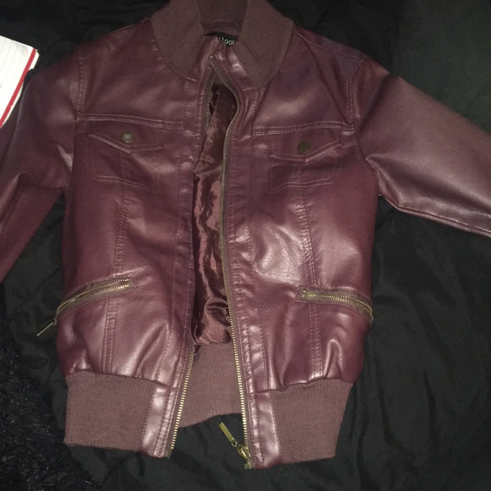 Maroon leather jacket.